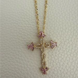 Gold and Pink Diamond Twisting Cross Pendant Necklace